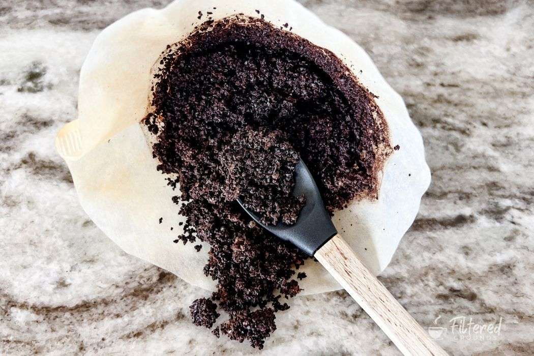 Coffee grounds that have been reused to make a cup of coffee