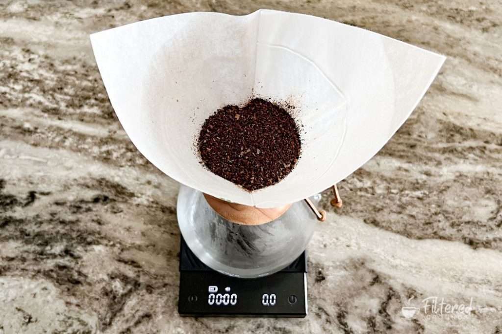 Coffee grounds in a Chemex on a kitchen scale