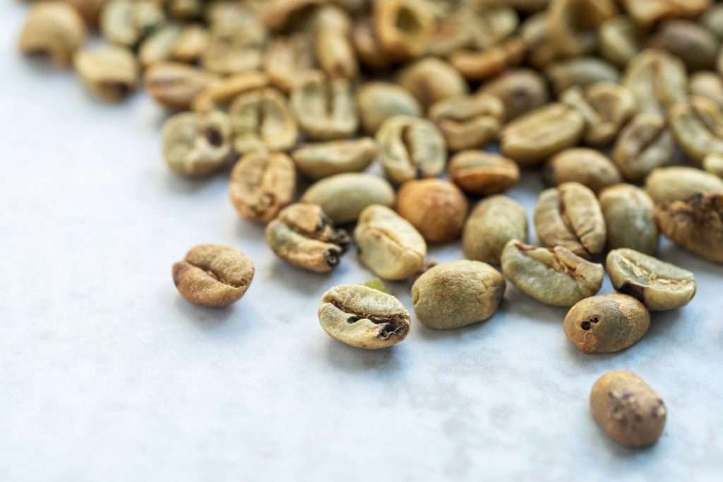 Green coffee beans with different defects