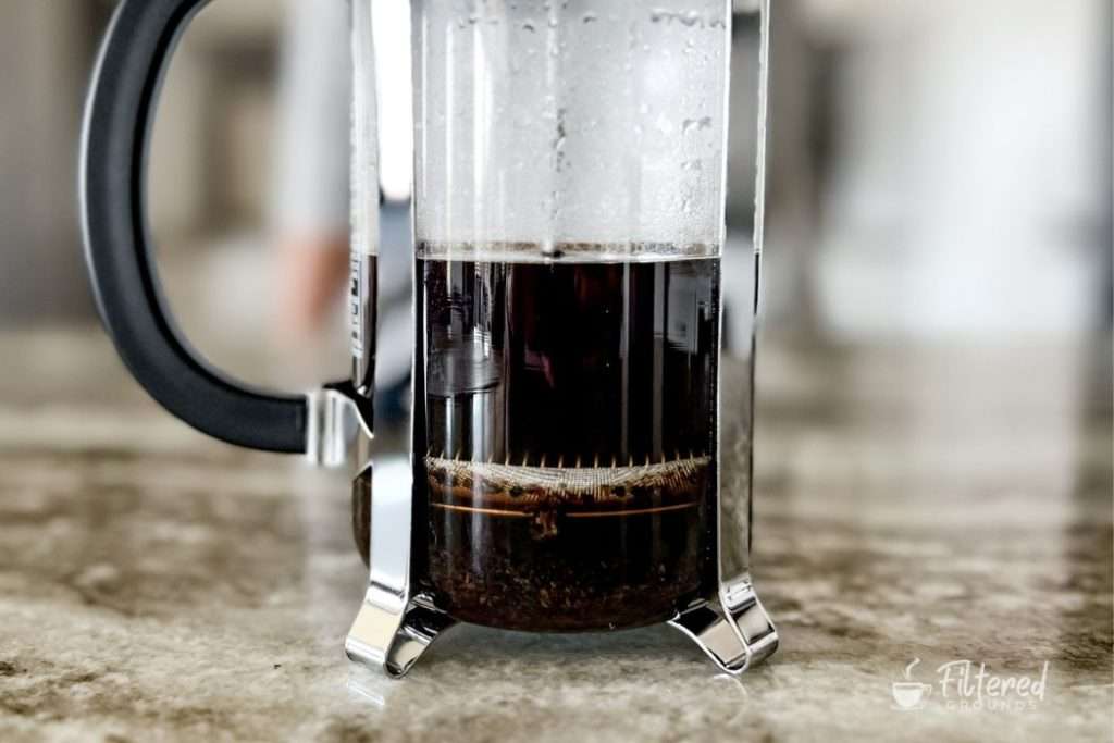 French press with its plunger fully pressed