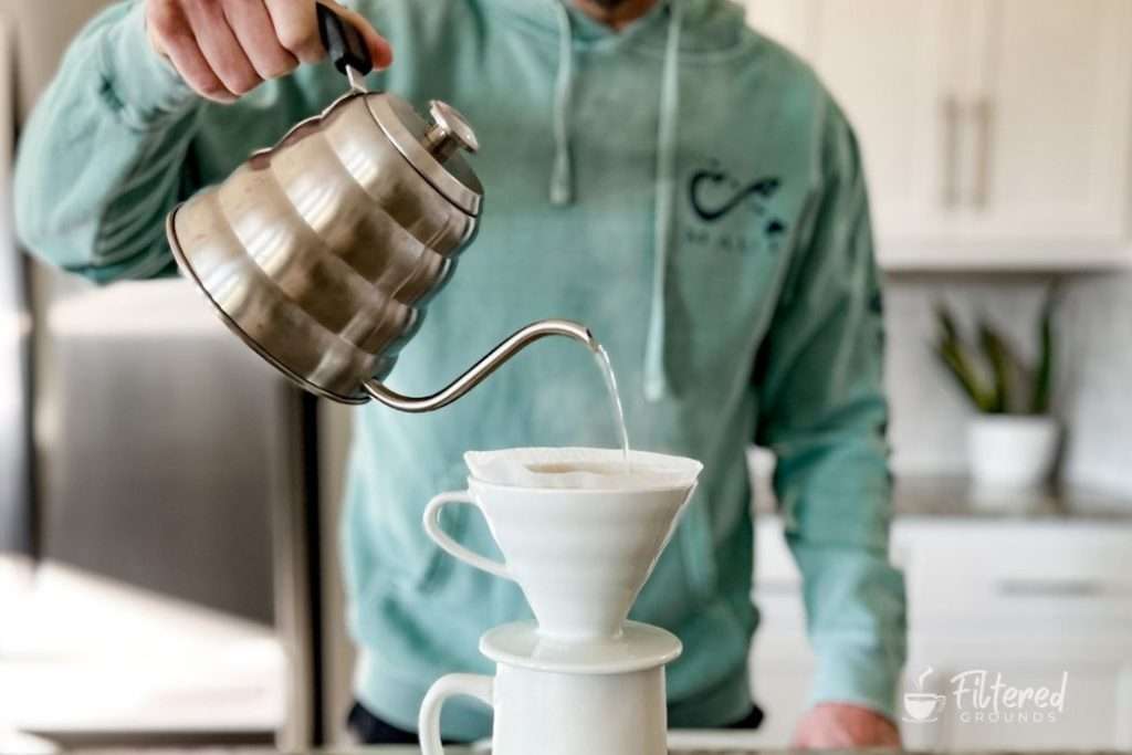 Home barista learning how to make pour-over coffee